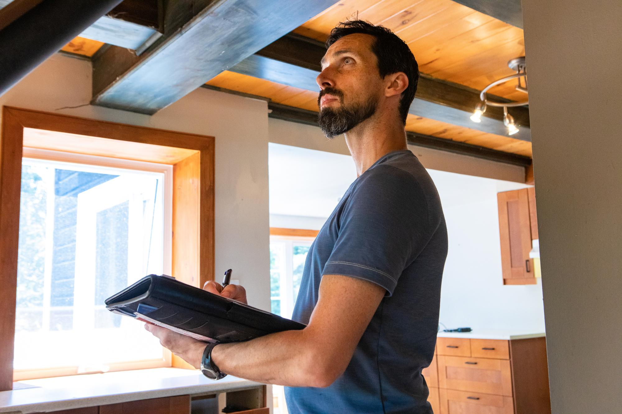 Mastering Investment Property Due Diligence - man performing a home inspection